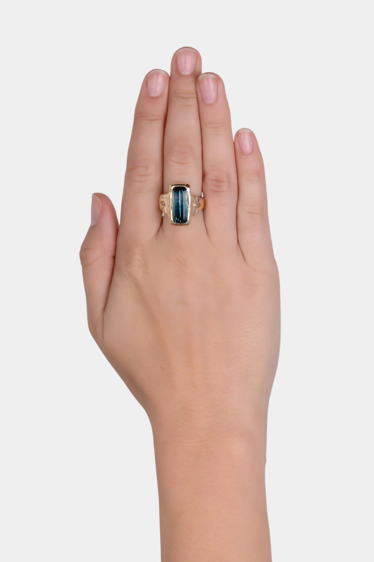 Portsea Ring wearing on hand
~ 6.5ct emerald cut bi colour tourmaline
~ two 0.25ct approx pear cut fancy yellow natural diamonds
~ four white pear cut melee diamonds