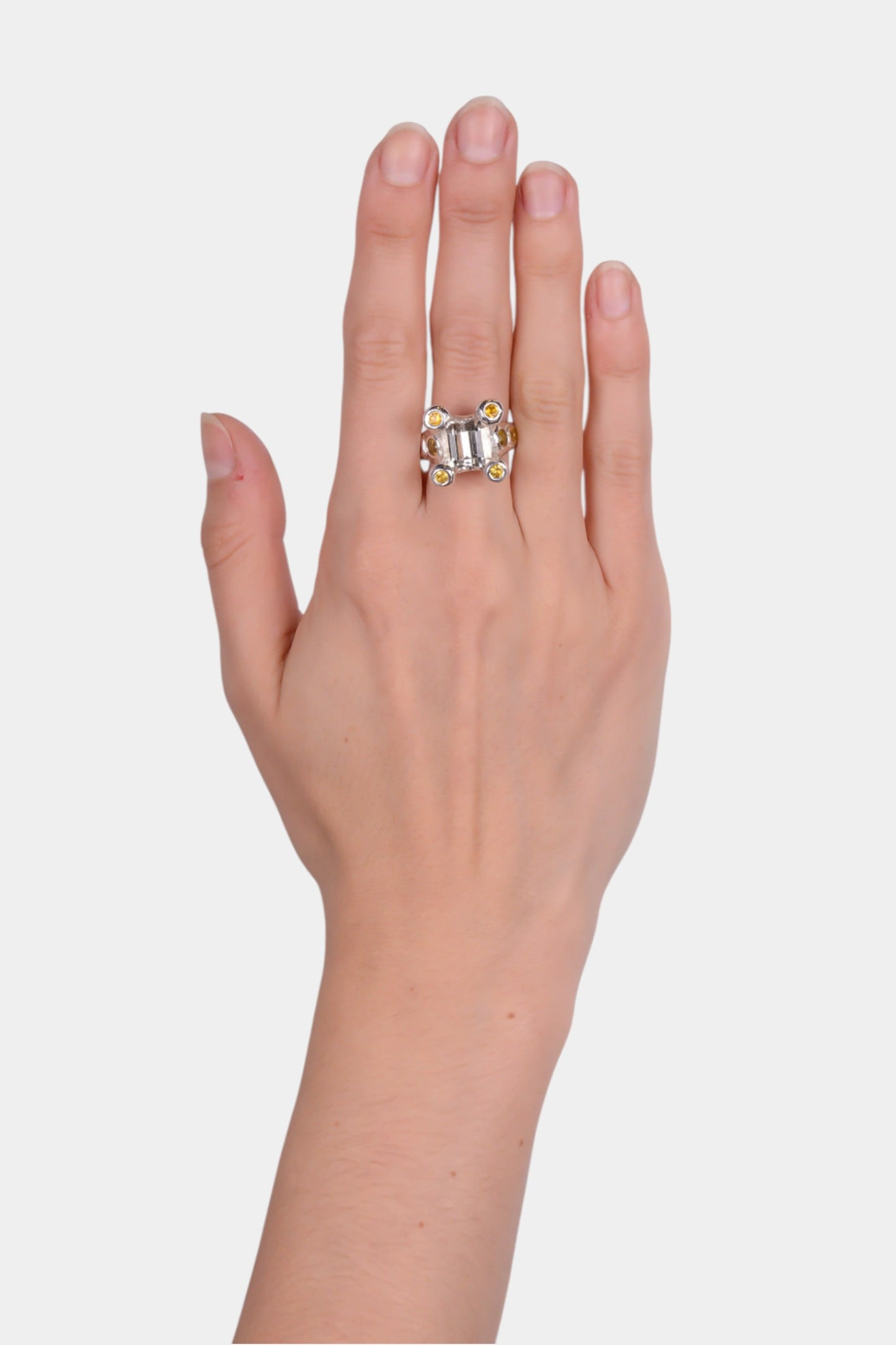 Sayonara Ring - yellow sapphires, pale yellow zircon wearing on hand