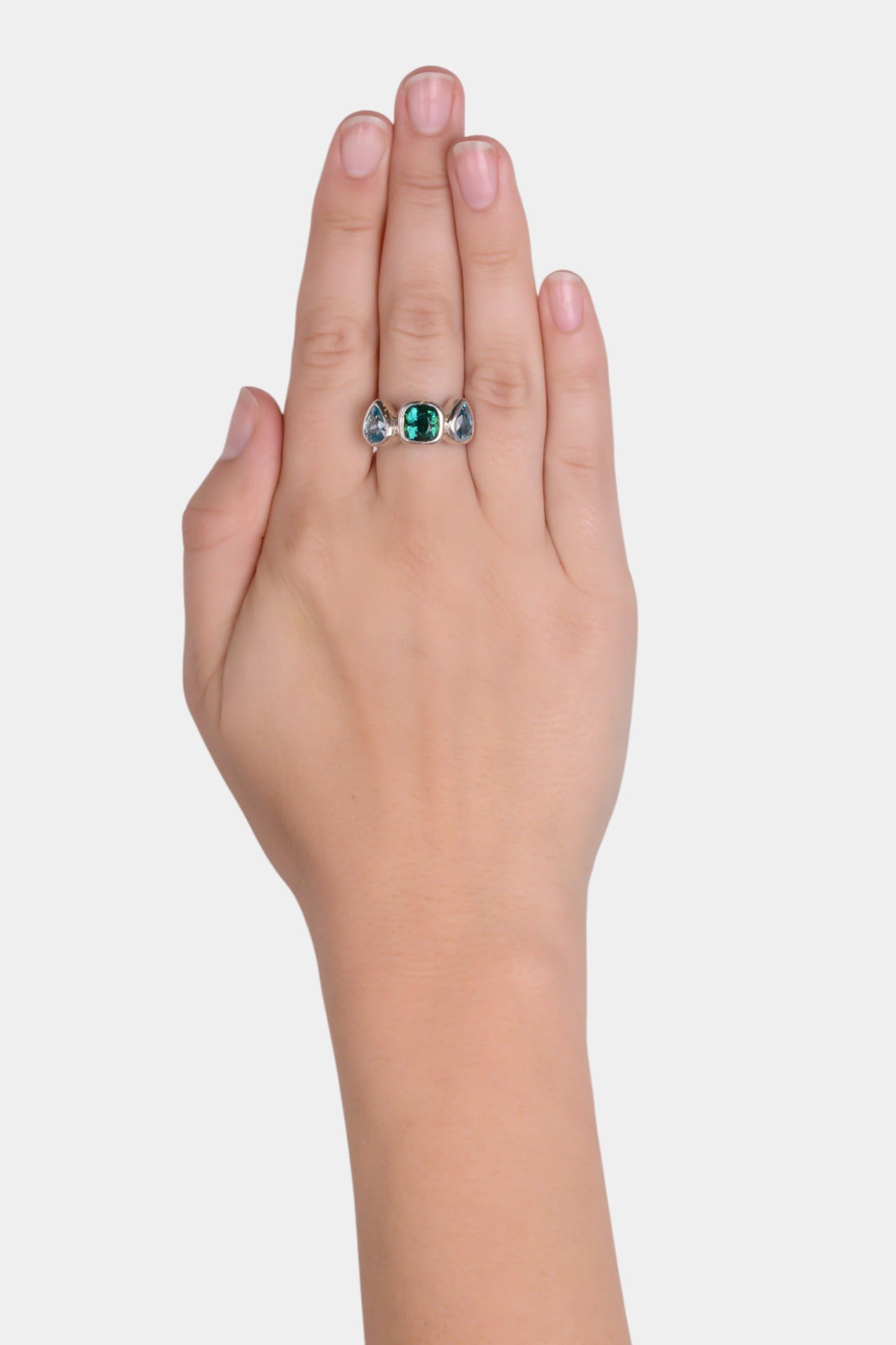 Vamp Ring wearing on hand
~ two 8x6mm pear cut blue zircons
~ 2.4ct cushion cut green tourmaline
