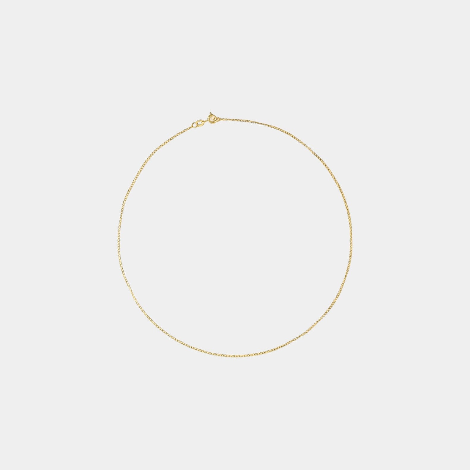 A 9 karat yellow gold necklace with a delicate chain design, displayed on a plain background.