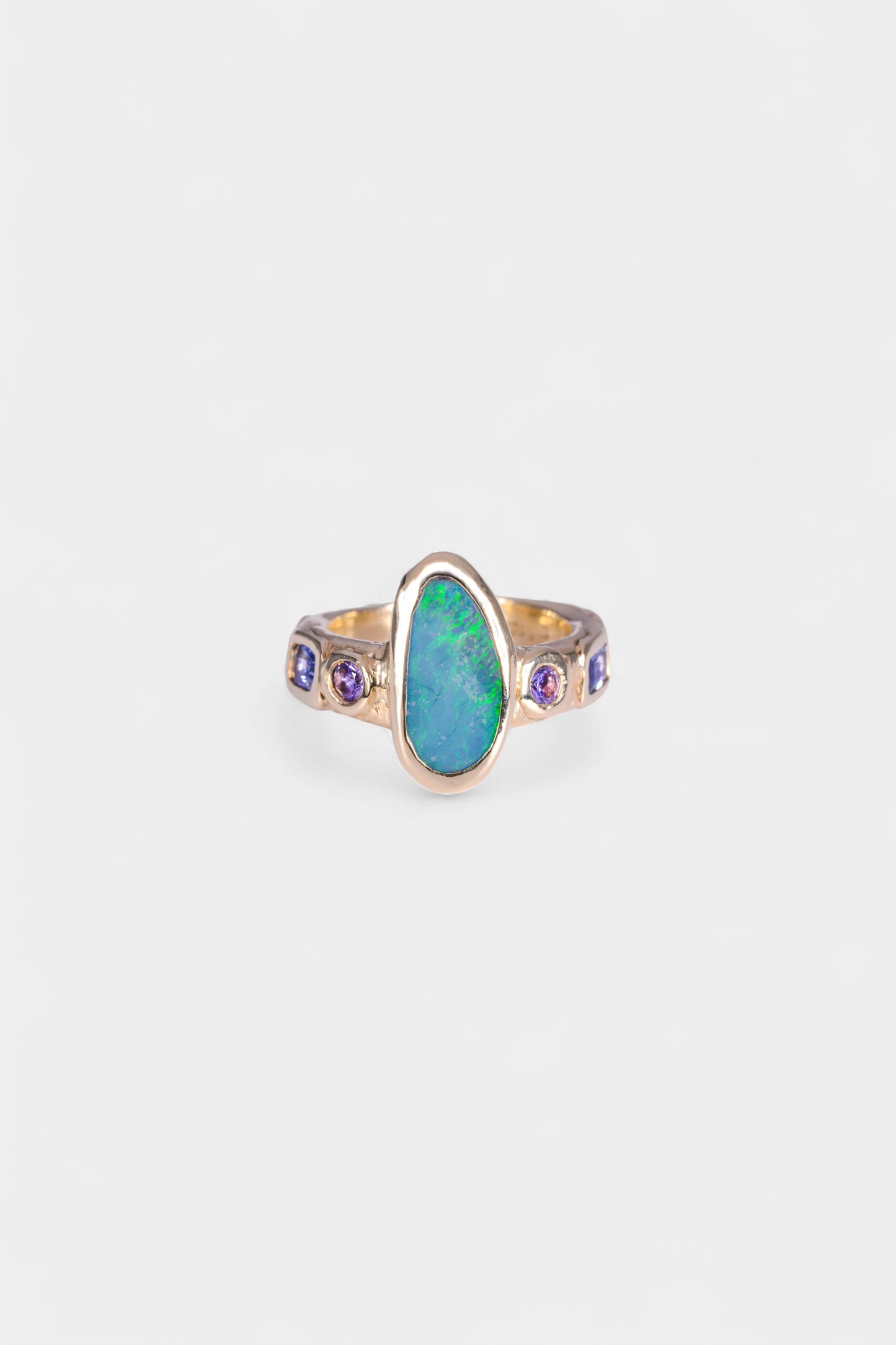Mills Ring 
~ four 3mm round pink sapphires
~ two 3x5mm emerald cut blue sapphires
~ 14x7mm Aussie opal doublet