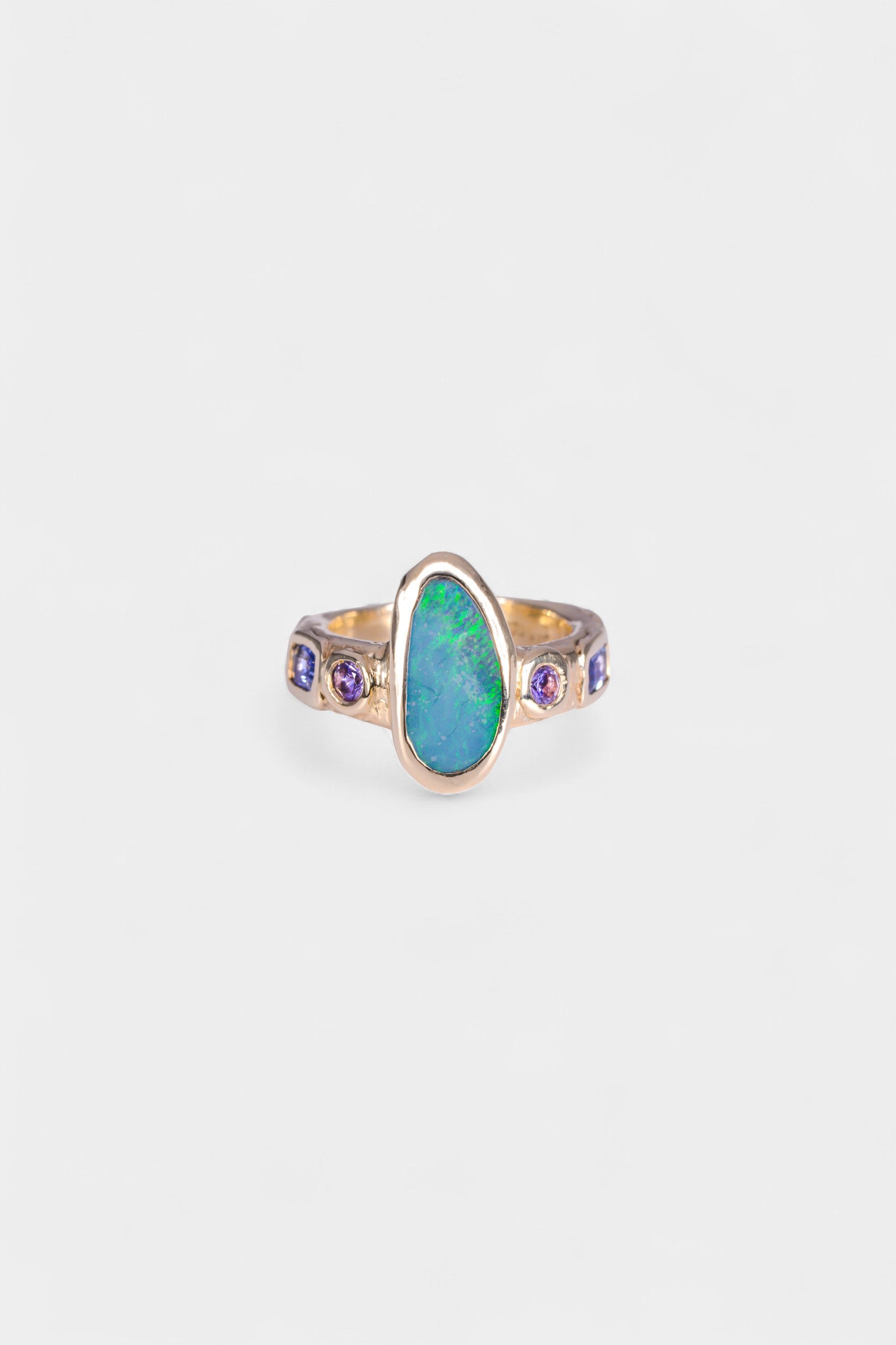 Mills Ring 
~ four 3mm round pink sapphires
~ two 3x5mm emerald cut blue sapphires
~ 14x7mm Aussie opal doublet